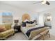Bright main bedroom features an en suite bathroom and decor that adds to the neutral color scheme at 1285 E Horseshoe Ave, Gilbert, AZ 85296