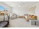Bright bedroom featuring a window with shutters, recliner, and toddler's bed, perfect for a space at 1285 E Horseshoe Ave, Gilbert, AZ 85296