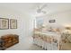 Charming bedroom with a white iron bed frame, decorative trunk, and ample closet space at 1285 E Horseshoe Ave, Gilbert, AZ 85296