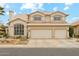 Spacious two-story home featuring three garage doors, desert landscaping, and neutral exterior paint at 1285 E Horseshoe Ave, Gilbert, AZ 85296