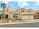 Inviting two-story home featuring a tile roof, lush desert landscaping, and a convenient two-car garage at 1285 E Horseshoe Ave, Gilbert, AZ 85296