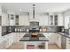 A spacious kitchen with stainless steel appliances, granite countertops, and modern lighting fixtures at 1285 E Horseshoe Ave, Gilbert, AZ 85296