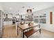 An open-concept kitchen featuring white cabinets, stainless steel appliances, and a large center island at 1285 E Horseshoe Ave, Gilbert, AZ 85296