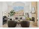 Stunning living room with vaulted ceilings, a stone fireplace, and large windows offering plenty of natural light at 1285 E Horseshoe Ave, Gilbert, AZ 85296