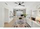 Home office offers plenty of storage with custom built-ins and white drawer units plus a ceiling fan at 1285 E Horseshoe Ave, Gilbert, AZ 85296