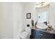Charming powder room featuring a unique vessel sink, marble countertop, and modern fixtures at 1285 E Horseshoe Ave, Gilbert, AZ 85296