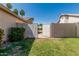 Backyard view showing the yard and entrance to the other back yard at 1343 W San Carlos Pl, Chandler, AZ 85248