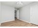 Bright bedroom with wood floors, ceiling fan, closet with sliding doors and door to the hall at 1343 W San Carlos Pl, Chandler, AZ 85248