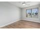 Bright bedroom features a window with natural light and an open floor plan with wood flooring at 1343 W San Carlos Pl, Chandler, AZ 85248