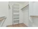 Walk-in closet featuring built-in shelving and ample space for organization at 1343 W San Carlos Pl, Chandler, AZ 85248