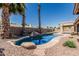 Scenic backyard pool area with towering palm trees and serene lounging space at 1343 W San Carlos Pl, Chandler, AZ 85248