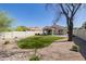 Expansive backyard with manicured lawn, desert landscaping, covered patio, offering a private outdoor retreat at 14239 N Edgeworth Dr # A, Fountain Hills, AZ 85268