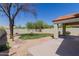 Spacious backyard has desert landscaping, a covered patio, and mature trees at 14239 N Edgeworth Dr # A, Fountain Hills, AZ 85268