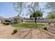 Beautiful backyard featuring a well-maintained lawn, patio area, desert landscaping and a mature shade tree at 14239 N Edgeworth Dr # A, Fountain Hills, AZ 85268