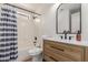 Well-lit bathroom with a shower-tub combo, a single sink vanity, and modern fixtures at 14239 N Edgeworth Dr # A, Fountain Hills, AZ 85268