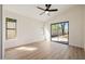 Bright bedroom with plank floors, ceiling fan, and sliding doors to the patio at 14239 N Edgeworth Dr # A, Fountain Hills, AZ 85268