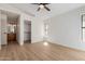 Spacious bedroom with hardwood floors, a walk-in closet, and ample natural light at 14239 N Edgeworth Dr # A, Fountain Hills, AZ 85268