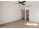 Spacious bedroom featuring plank floors, ceiling fan, and walk-in closet at 14239 N Edgeworth Dr # A, Fountain Hills, AZ 85268