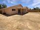 Expansive backyard offering ample space, a covered patio, and possibilities for customization at 15162 W Monroe St, Goodyear, AZ 85338