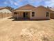 Spacious backyard with a covered patio, ready for landscaping and outdoor enjoyment at 15162 W Monroe St, Goodyear, AZ 85338