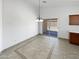 Open dining room with tile floors, a chandelier and sliding glass doors to the outside at 15162 W Monroe St, Goodyear, AZ 85338