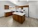 Well-equipped kitchen featuring an island, stainless steel appliances, and ample counter space at 15162 W Monroe St, Goodyear, AZ 85338