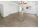 Expansive living room featuring tile flooring, recessed lighting, and an open design at 15162 W Monroe St, Goodyear, AZ 85338