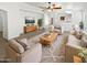 Bright living room with neutral colors, modern furnishings, and an open layout at 15162 W Monroe St, Goodyear, AZ 85338