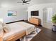 Relaxing main bedroom features fan, TV, and ensuite bathroom at 15162 W Monroe St, Goodyear, AZ 85338