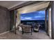 Cozy balcony seating area offering city views, seamlessly integrated with the interior living space at 15215 N Kierland Blvd # 636, Scottsdale, AZ 85254