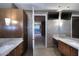 Modern bathroom with gray cabinets, dual sinks, and beautiful natural light at 15215 N Kierland Blvd # 636, Scottsdale, AZ 85254