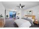 Brightly lit primary bedroom features neutral tones, a ceiling fan, and a city view at 15215 N Kierland Blvd # 636, Scottsdale, AZ 85254