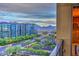 Balcony view featuring buildings, road, and mountain range, creating a scenic city panorama at 15215 N Kierland Blvd # 636, Scottsdale, AZ 85254