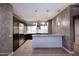 Sleek kitchen with stainless steel appliances, a breakfast bar, and modern lighting at 15215 N Kierland Blvd # 636, Scottsdale, AZ 85254