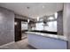 Modern kitchen featuring stainless steel appliances, granite countertops, and pendant lighting at 15215 N Kierland Blvd # 636, Scottsdale, AZ 85254