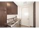 Efficient laundry room equipped with modern washer and dryer units at 15215 N Kierland Blvd # 636, Scottsdale, AZ 85254