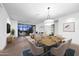 Bright, open-concept living room features a dining area, balcony, and views of the city at 15215 N Kierland Blvd # 636, Scottsdale, AZ 85254
