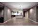 Open-concept living area with a kitchen and elegant lighting fixtures at 15215 N Kierland Blvd # 636, Scottsdale, AZ 85254