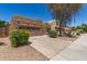 Charming single-story home featuring a well-manicured front yard and a two-car garage at 15674 W Mackenzie Dr, Goodyear, AZ 85395