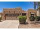 Charming single-story home featuring a well-manicured front yard and a two-car garage at 15674 W Mackenzie Dr, Goodyear, AZ 85395