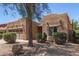 Charming single-story home featuring a well-manicured front yard and a two-car garage at 15674 W Mackenzie Dr, Goodyear, AZ 85395