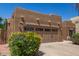 Charming single-story home featuring a well-manicured front yard and a two-car garage at 15674 W Mackenzie Dr, Goodyear, AZ 85395