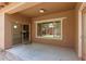 Cozy covered patio featuring a sliding glass door and natural light, great for entertaining at 15674 W Mackenzie Dr, Goodyear, AZ 85395