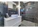 Modern bathroom features a sleek vanity, contemporary fixtures, and a glass-enclosed shower at 1617 W Lamar Rd, Phoenix, AZ 85015