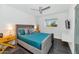 Stylish bedroom with a turquoise bed, a side table, and a neutral color scheme at 1617 W Lamar Rd, Phoenix, AZ 85015