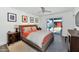Cozy main bedroom featuring a large bed, sliding door access to the backyard, and modern decor at 1617 W Lamar Rd, Phoenix, AZ 85015