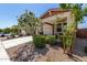 Charming single-Gathering home boasts desert landscaping, a two-car garage, and a covered porch with stone accents at 17171 W Tonto St, Goodyear, AZ 85338