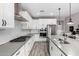 Modern kitchen with stainless steel appliances, gas stove and white cabinets at 17171 W Tonto St, Goodyear, AZ 85338