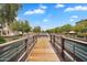 Scenic view from a bridge over a lake with lush landscaping and community architecture in the background at 1727 E Chelsea Ln, Gilbert, AZ 85295