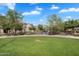 View of a park with grassy areas and pond at 1727 E Chelsea Ln, Gilbert, AZ 85295